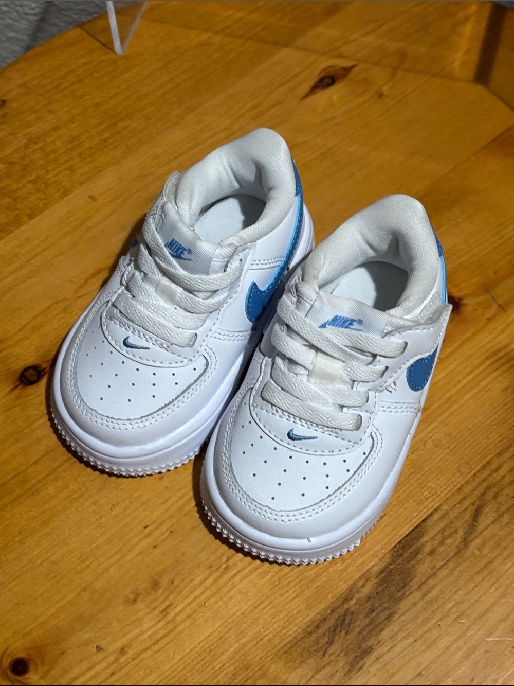 Nike Kids White Sneakers with Blue Swoosh 5C